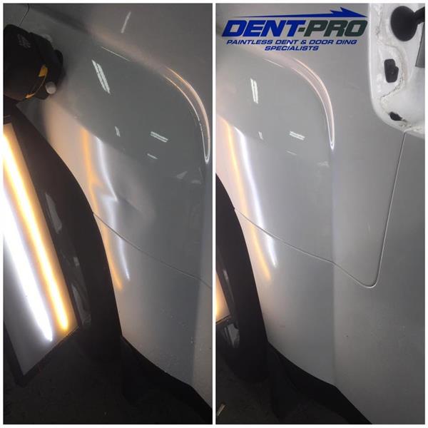 Before and after paintless dent repair on a white GMC Terrain quarter panel