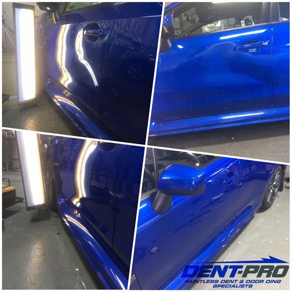 Paintless dent repair on a blue Subaru WRX door